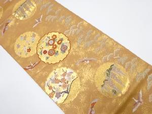 雪輪に小袖文織出し袋帯